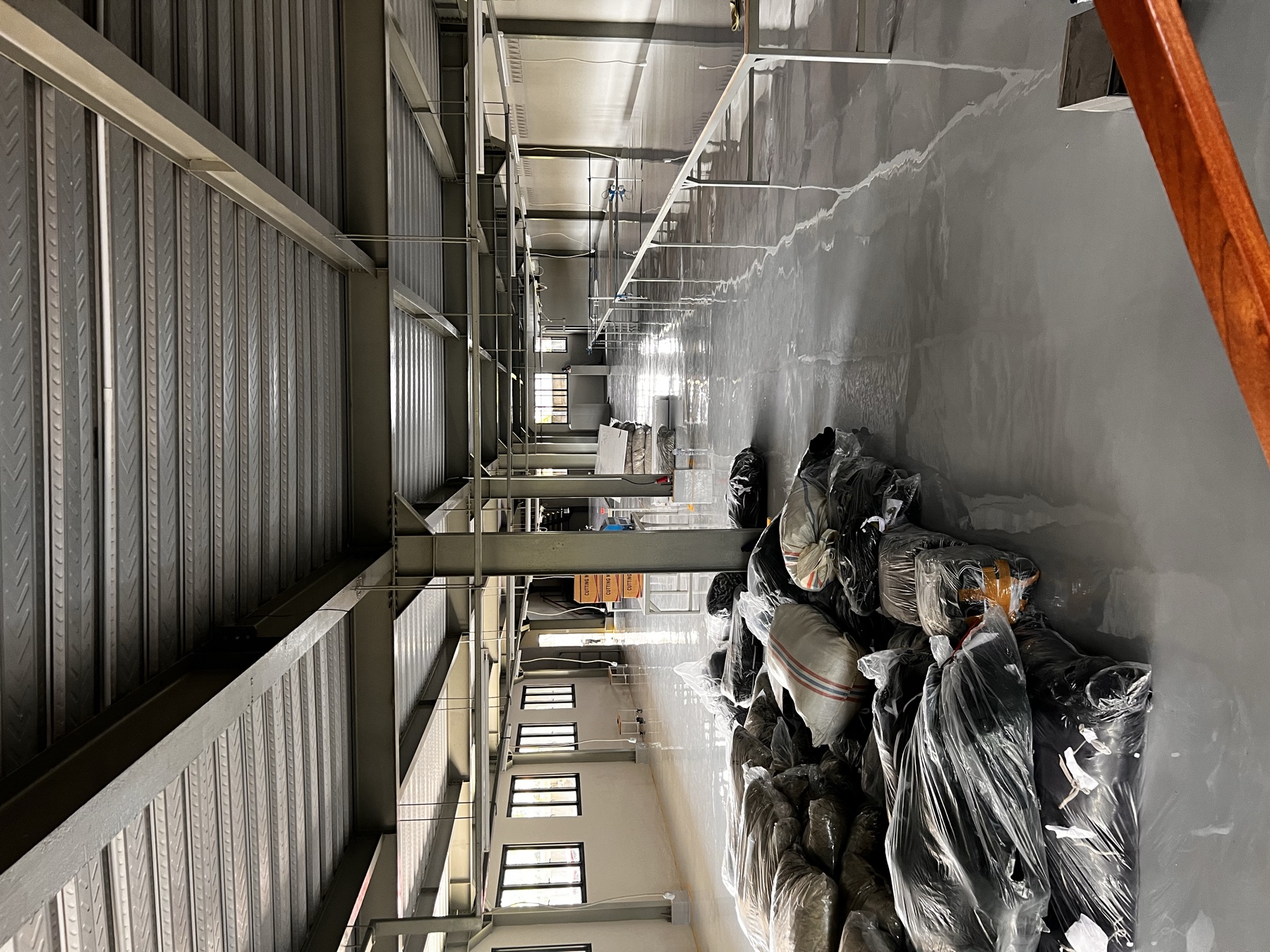FrontThread production facility floor with packed garments