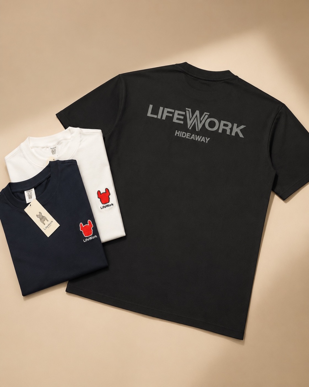 Black tee with a tonal back print and embroidered chest detail